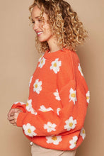 Load image into Gallery viewer, Woman wearing an orange drop shoulder sweater with a playful white daisy design, round neck, and long sleeves. Winter clothes for women.
