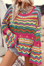 Load image into Gallery viewer, Woman wearing colorful openwork knit sweater with long sleeves, ideal for winter wardrobe, women&#39;s winter clothes.
